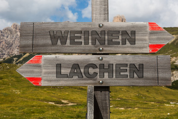 Heinweis Schild mit lachen und weinen