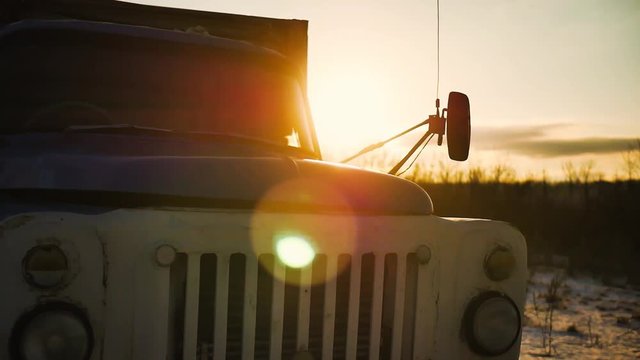 Old farm truck in sunset