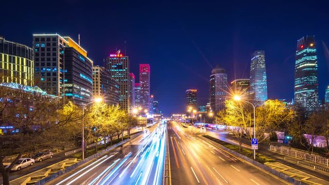 Time lapse of busy traffic and modern buildings in Beijing city , China.
