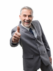 Confident business executive giving a thumbs up