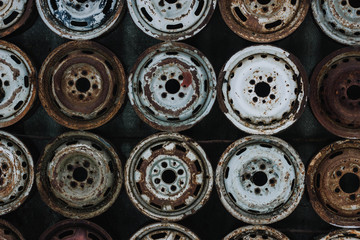 Wall of old car wheels