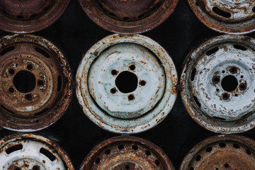 Wall of old car wheels