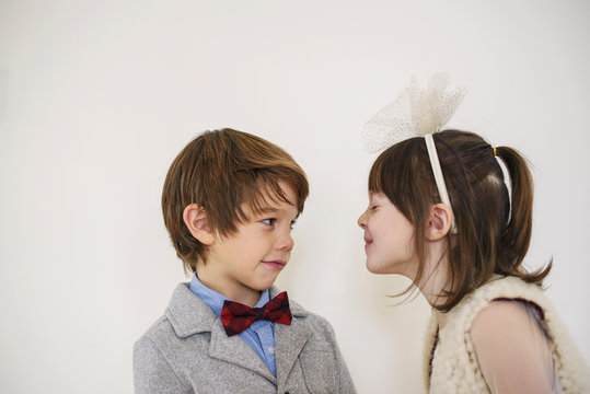 Portrait of a boy and girl looking at each other