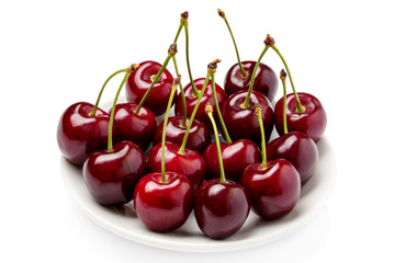 Cherry berries on a white plate isolated on white background cutout