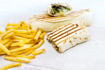 Mexican fajita wraps with grilled chicken fillet and fresh vegetables