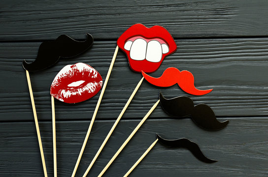 photo props- paper mustache, mouth, lips  on grey wooden background
