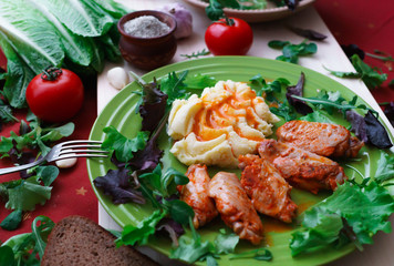 fried chicken wings with potato puree, sprinkled with sweet paprika sauce.