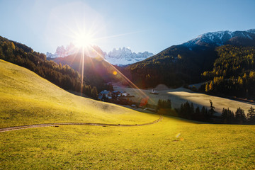 View of the alpine hill that glowing by sunlight. Location Funes valley, Dolomites. South Tyrol....