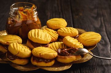 Homemade corn shortbread cookies with caramel sauce.