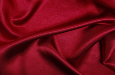 Obraz premium Smooth elegant red silk or satin luxury cloth texture as abstract background. Luxurious valentines day background design