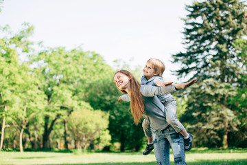 Fototapeta premium happy mother and son playing in the Park