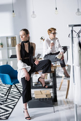 young fashion designers sitting on work desk at office