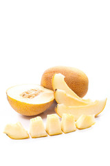 Whole, half and sliced honeydew melon tropical fruit isolated on a white background.