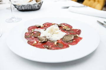 Beef carpaccio served on a plate