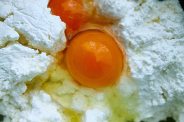 The eggs on the white curd from russian village close-up 