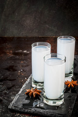 Traditional arabic alcohol drink Raki with anise, dark rusty background copy space