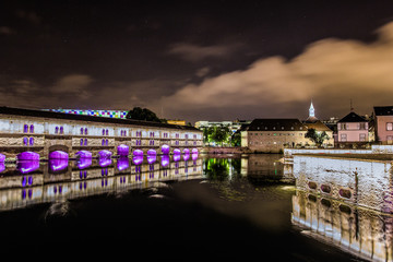 Night illumination of Barrage Vauban, medieval bridge Ponts Couverts, in Strasbourg, France