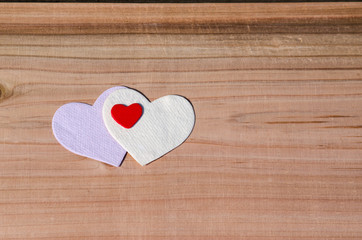 three Hearts on Wooden Background. Family, Valentine Day, Wedding Love Concept. xxx