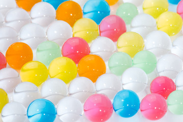 Fototapeta na wymiar Balls of colored polymer gel, hydrogel beads