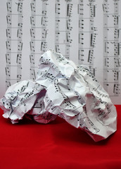 crumpled sheet music lying