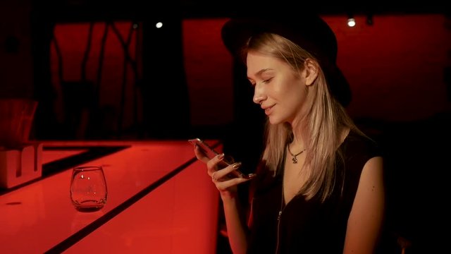 Blone girl is texting message