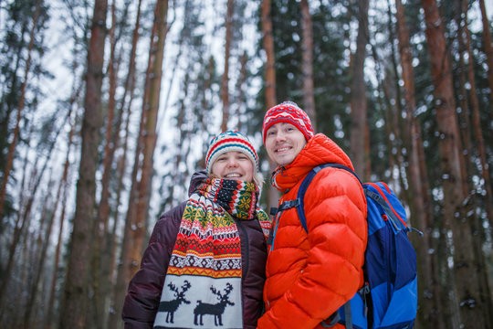 Image of happy couple on walk in winter forest