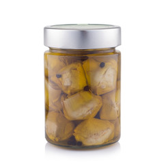 delicious marinated mushrooms in the glass jar isolated on white