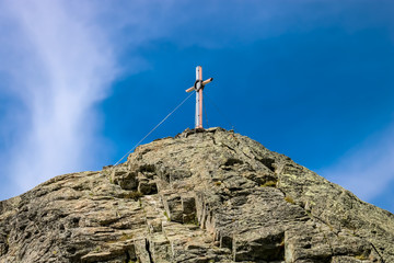 Summit cross on the top of the mountain
