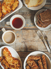 Meat deep-fried and eggplant and tomato salad on the table - meal