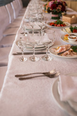 Empty glasses set in restaurant. Wineglasses served for a festive dinner.