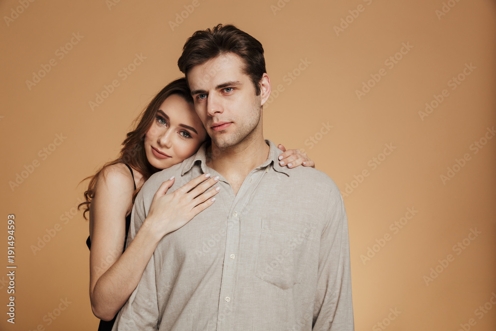 Wall mural Portrait of an attractive loving couple hugging