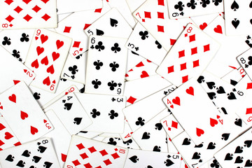 Red and black playing cards as background