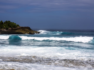 Fototapeta na wymiar Waves in the turbulent sea, near Lembongan Island, Indonesia