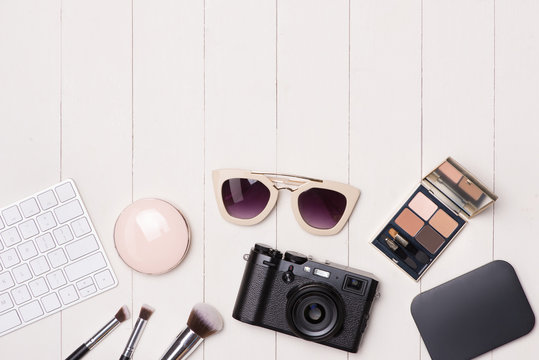 Women Cosmetics And Fashion Items On Table With Camera And Passport. Top View