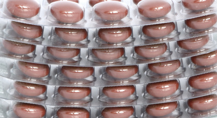 brown tablets are in blisters, macro