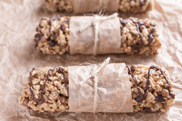 Chocolate Energy Bar with Fruits and Nuts. Useful sweetness consists of oatmeal, nuts, chocolate, honey.