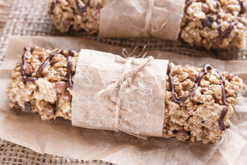 Chocolate Energy Bar with Fruits and Nuts. Useful sweetness consists of oatmeal, nuts, chocolate, honey.