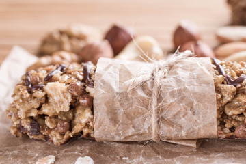 Chocolate Energy Bar with Fruits and Nuts. Useful sweetness consists of oatmeal, nuts, chocolate, honey.
