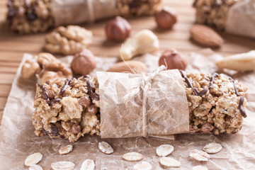 Chocolate Energy Bar with Fruits and Nuts. Useful sweetness consists of oatmeal, nuts, chocolate, honey.