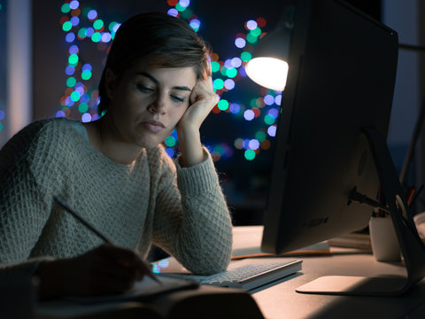 Woman working late at night