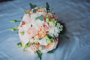 stylish beautiful bridal bouquet from different flowers