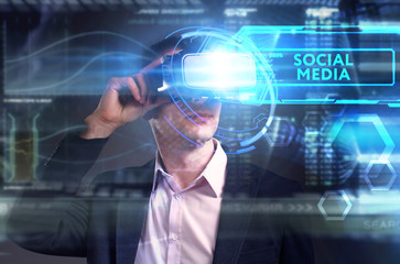 Business, Technology, Internet and network concept. Young businessman working on a virtual screen of the future and sees the inscription: Social media