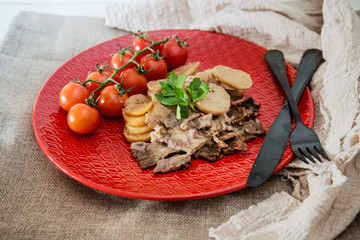 juicy steak veal beef meat with tomato and potatoes