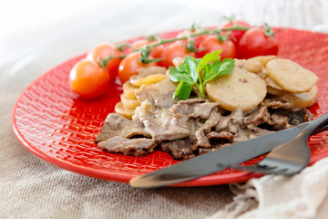 juicy steak veal beef meat with tomato and potatoes