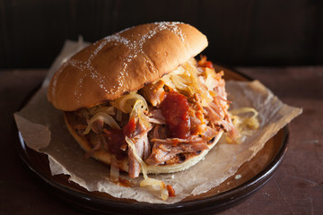 homemade pulled pork burger with caramelized onion and bbq sauce