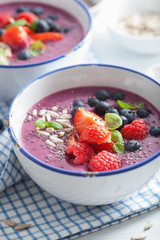 healthy berry smoothie bowl with strawberry blueberry raspberry and chia seed