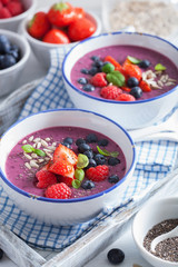 healthy berry smoothie bowl with strawberry blueberry raspberry and chia seed