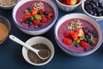 healthy berry smoothie bowl with strawberry blueberry raspberry and chia seed