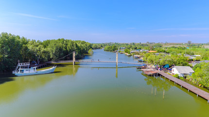 Fototapeta premium Raksamae bridge is over the canal for sightseeing to the mangrove forest at Rayong,Thailand