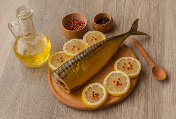 Mackerel smoked  and  lemon on a cutting board
